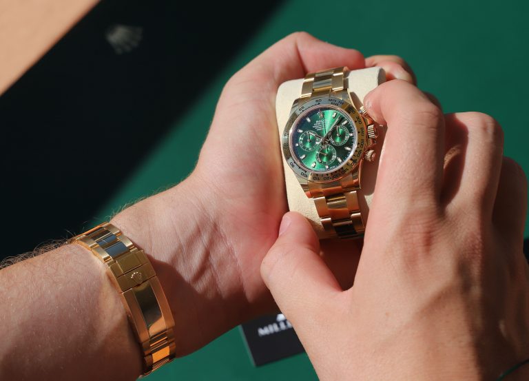 yellow gold day date green dial